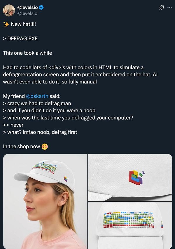 A woman models a white cap featuring a colorful defragmentation screen design.