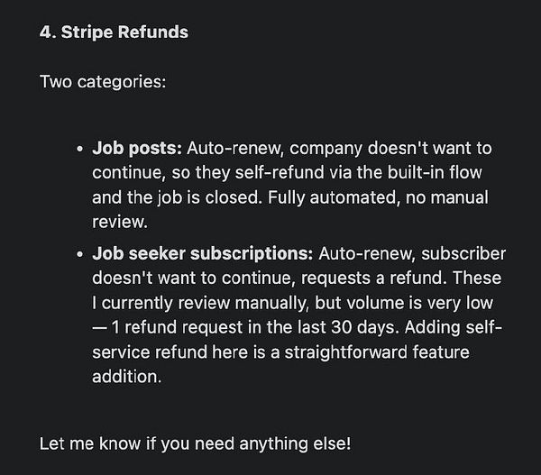 A laptop open on a desk displaying a detailed financial spreadsheet in Excel, next to a smartphone and a keyboard.