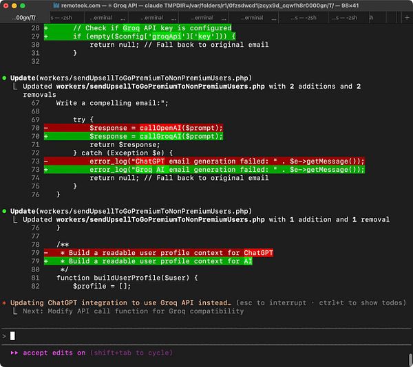 The image displays a code snippet from a terminal interface showing updates to a PHP script for sending upsell emails.