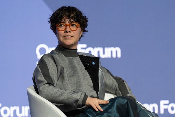 A speaker at the World Economic Forum is engaged in a discussion.