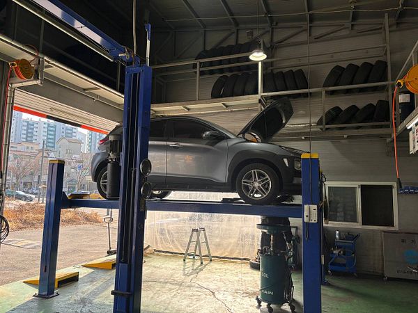 Close-up of a car engine with visible components and metallic parts.