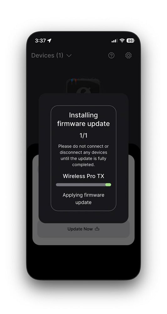 The image displays a mobile device screen showing a firmware update process for the Wireless Pro TX.
