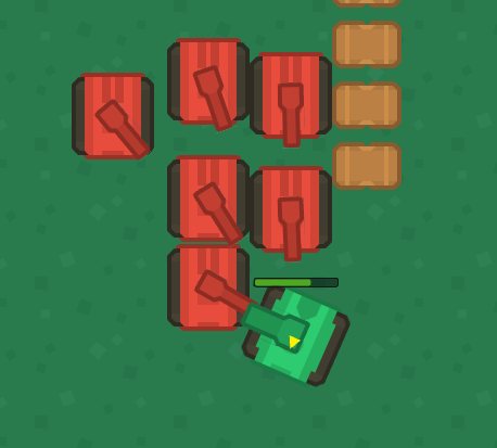 A top-down view of a tank game featuring a green tank and red health packs.