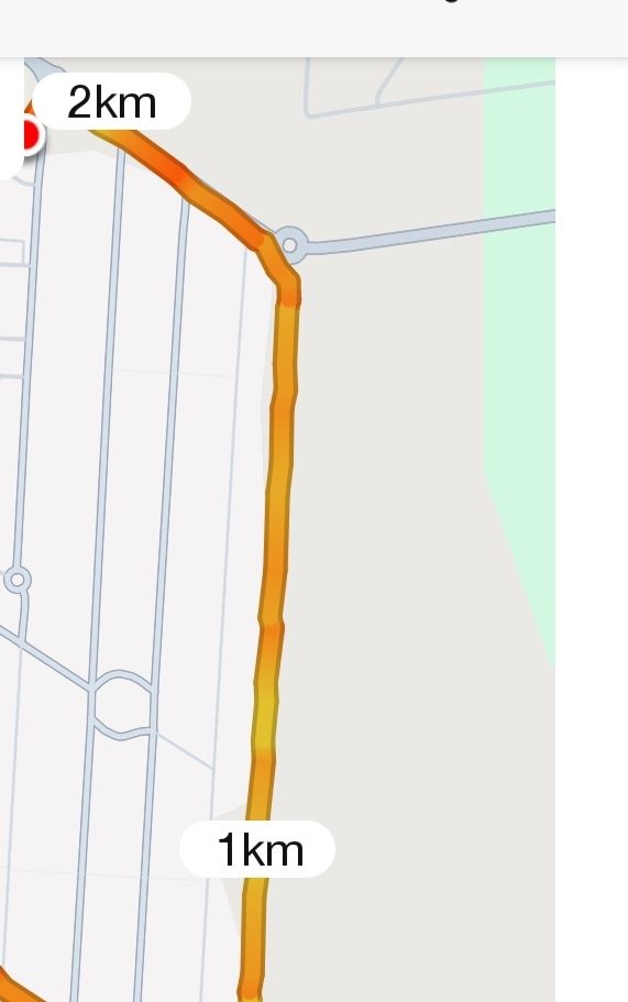 The image displays a map segment showing a running route with distance markers.