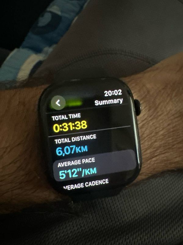 A smartwatch displays running statistics after a 6k run.