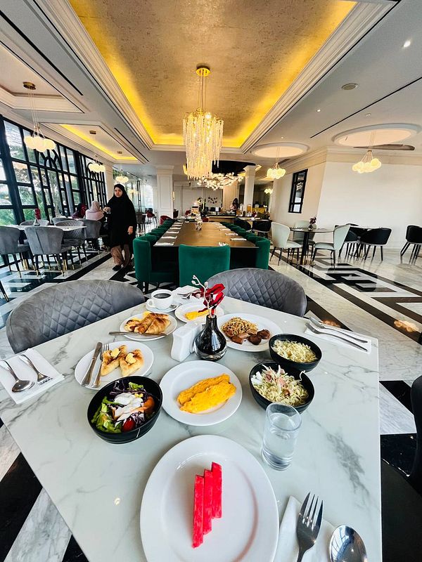 A beautifully arranged breakfast table in an elegant restaurant setting.
