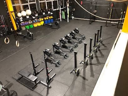 A well-equipped gym space featuring various fitness equipment.