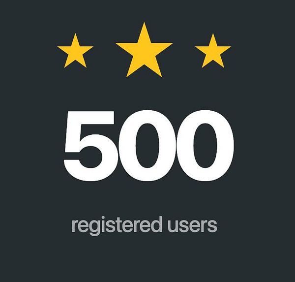 A graphic celebrating 500 registered users with three gold stars above the number.