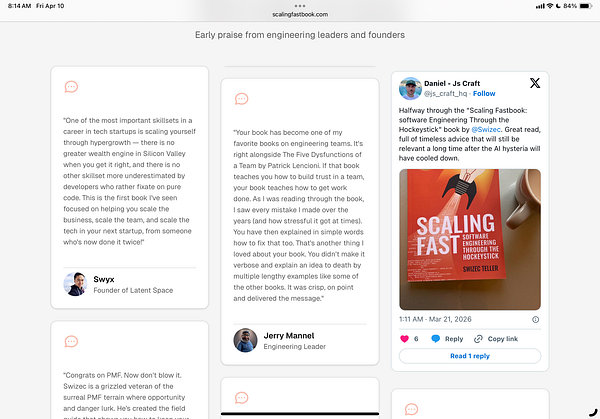 A black and white photograph of a man in a workspace with shelves and papers.