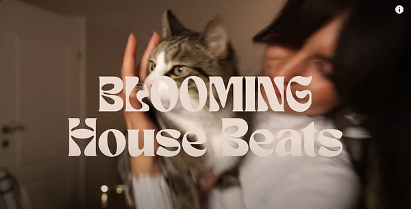 A woman holds a cat while the text 'BLOOMING House Beats' is prominently displayed.
