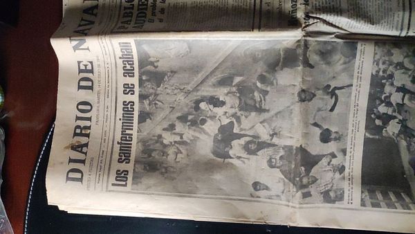 An old newspaper page featuring a headline about the Sanfermines festival.