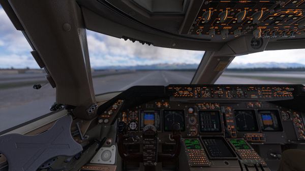 A Boeing 747 cargo plane is landing on a snowy runway in a remote Alaskan landscape with only one engine operating.