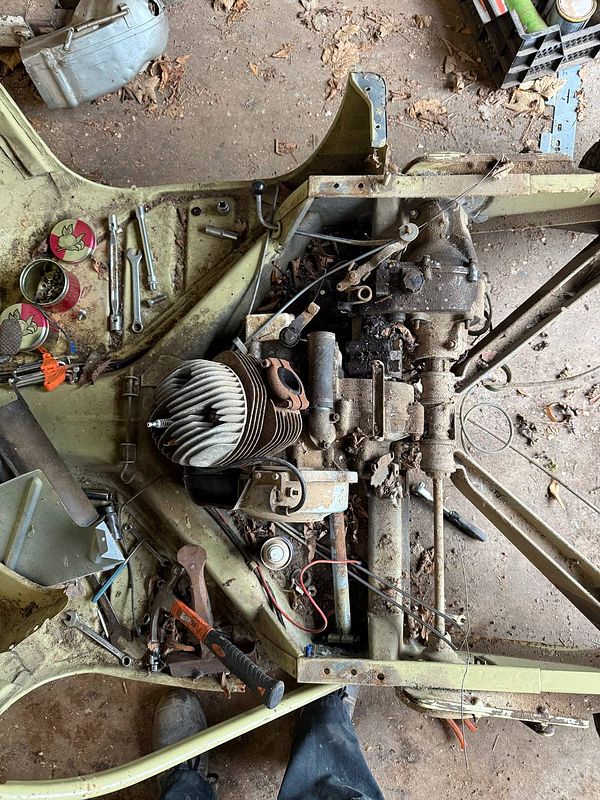 A work-in-progress wood project with tools laid out on a wooden surface, indicating DIY progress.