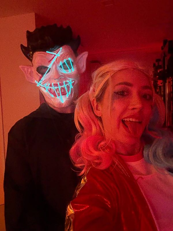 A Halloween-themed selfie featuring two individuals in costumes.