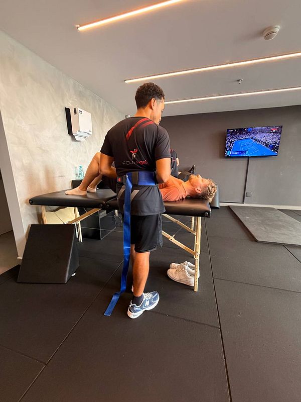 X-ray image of a left upper arm showing the humerus bone from shoulder to elbow.