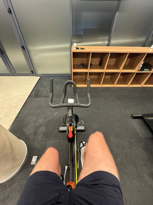 A view from above of a stationary bike in a gym setting.