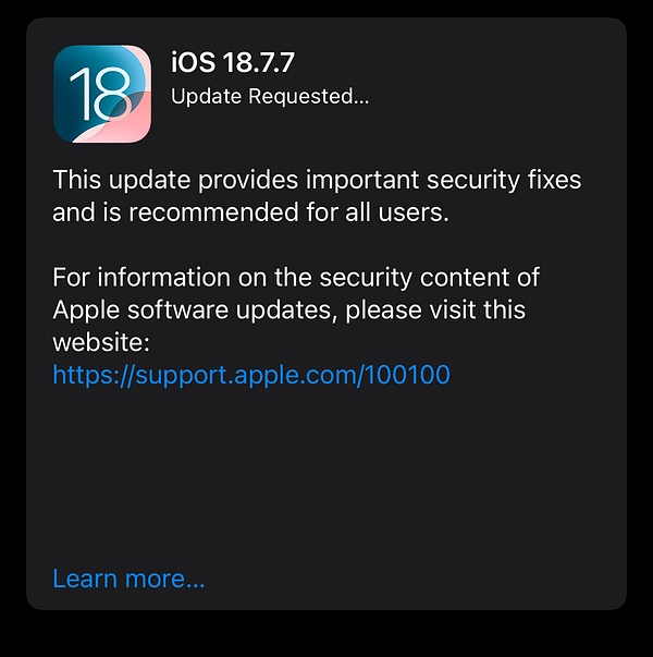 Close-up of a white iPhone displaying the iOS 18 update screen with an 'Update Requested' status.