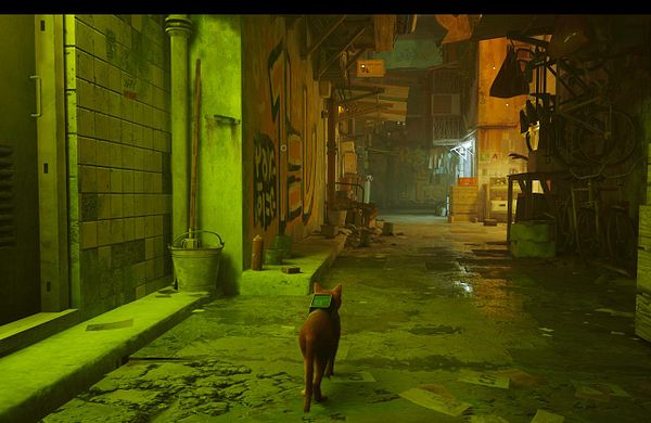 Screenshot of a Mac gaming setup with the game Stray running on a MacBook keyboard background.