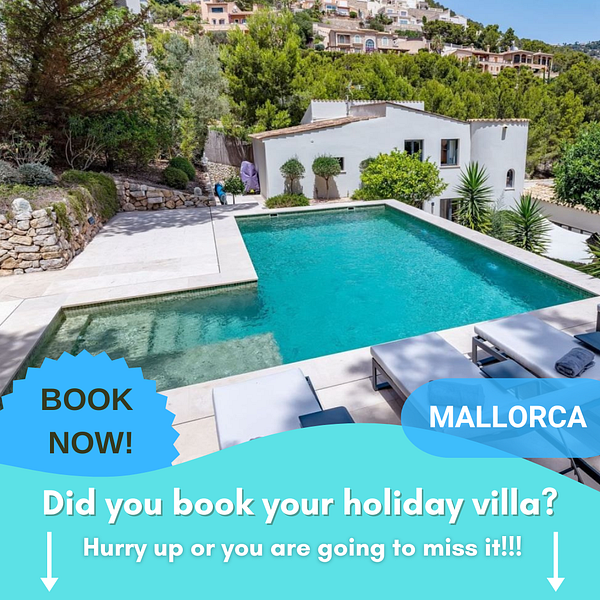 A luxurious villa with a swimming pool in Mallorca, surrounded by lush greenery.