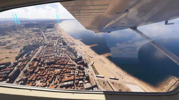 Aerial view of Costa de Caparica showcasing the coastline and urban landscape.