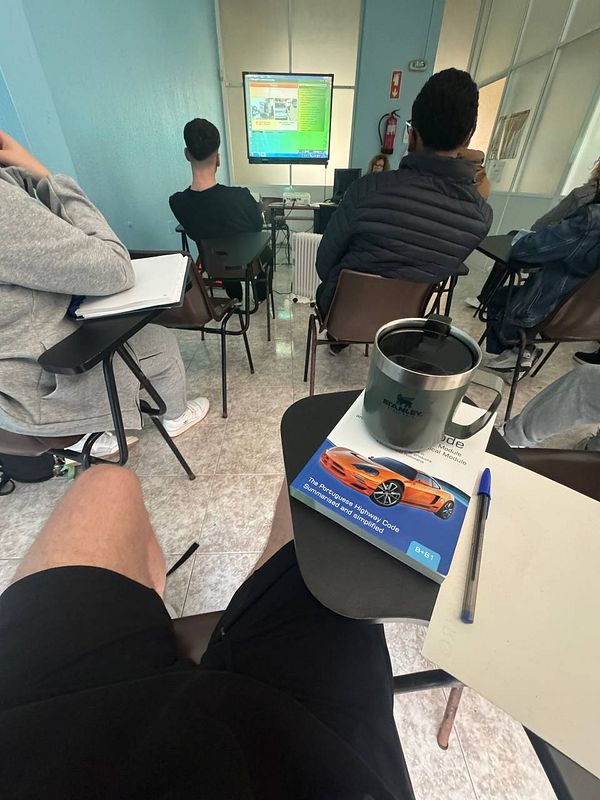 A classroom setting during a driving school theory class.