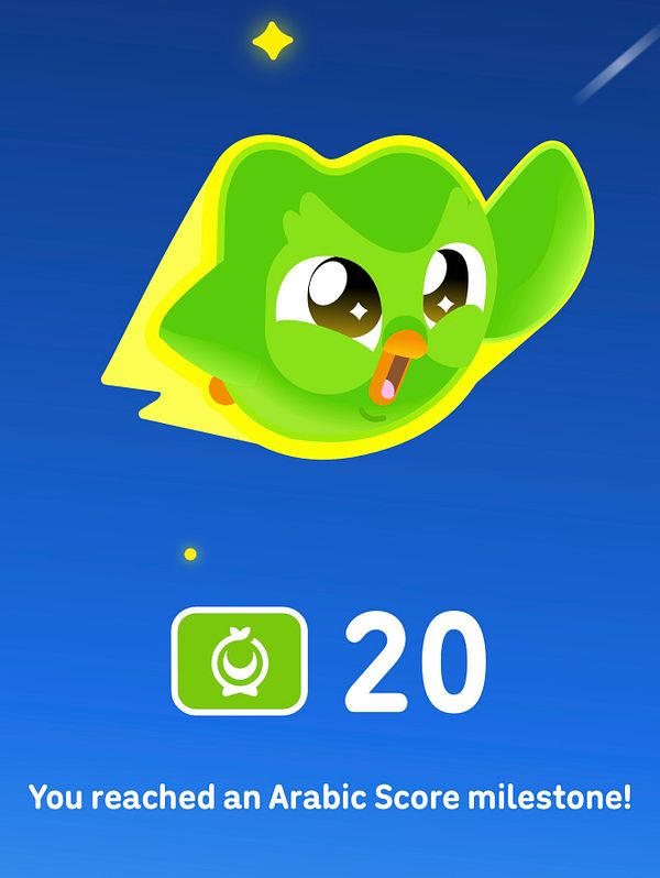 A Duolingo achievement screen showing a milestone reached for Arabic, with the mascot soaring and the score milestone of 20 displayed.