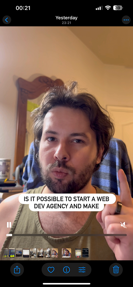 A man is speaking directly to the camera in a video about starting a web development agency.