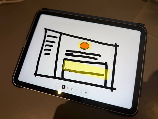 Screenshot of the Vibe Code iPad app interface featuring a dark-themed code editor, a small preview window, and UI controls for testing layouts and UX ideas.