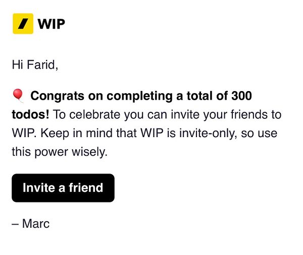 A photo of a black bicycle leaning against a white wall with a framed sign that reads 'DO MORE OF WHAT MAKES YOU HAPPY.'