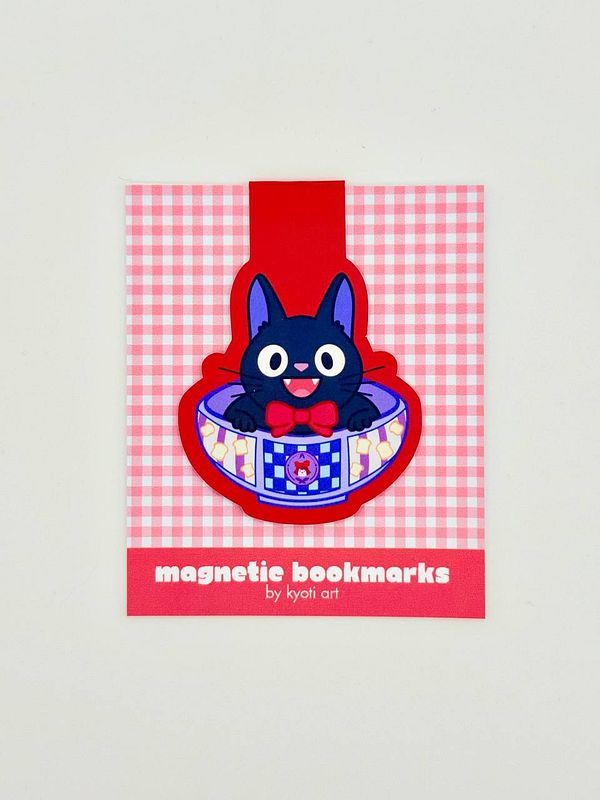 A colorful design featuring a cat-themed magnetic bookmark.