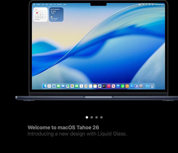 A MacBook Pro displays the welcome screen for macOS Tahoe 26.