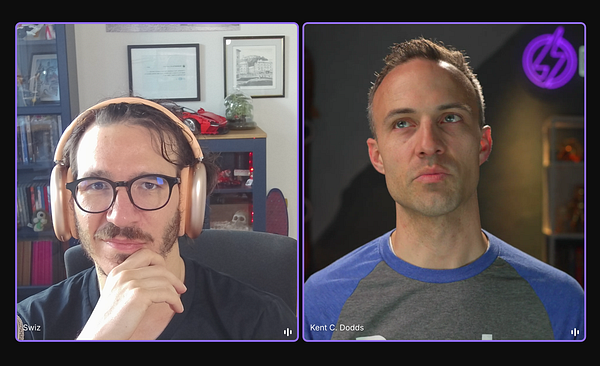 A podcast recording setup featuring two microphones, headphones, and a laptop on a wooden table in a cozy indoor environment.