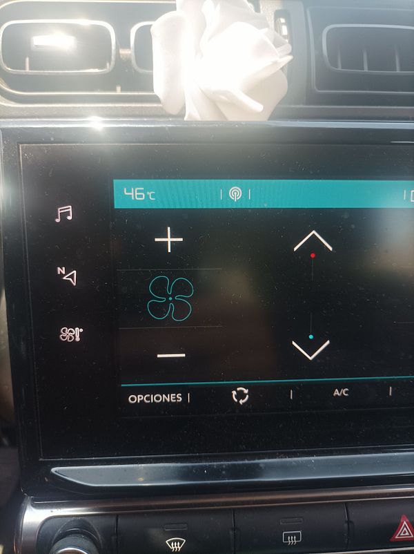 The image displays a car's climate control interface showing a temperature of 46°C.