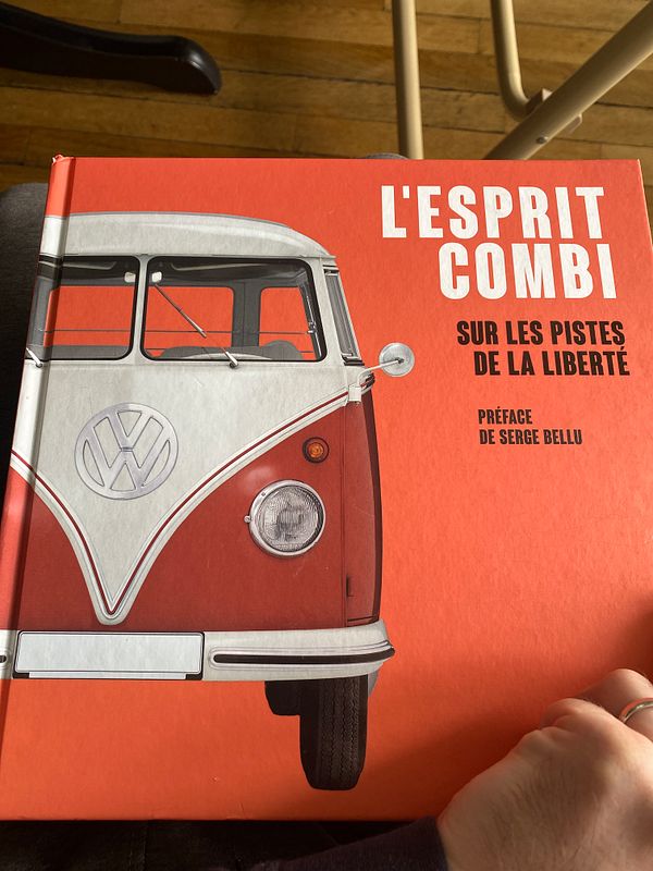 A close-up of a book cover featuring a vintage Volkswagen van.