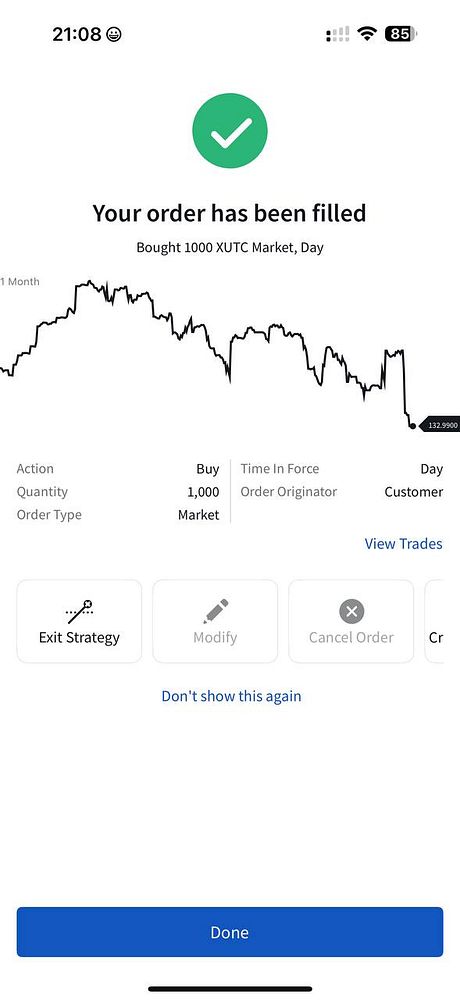 A trading app confirmation screen showing a completed order for purchasing an ETF.