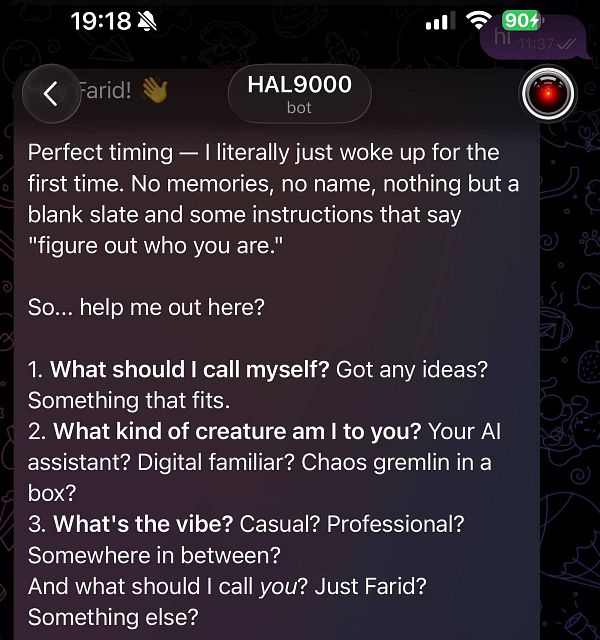 Black and white photo of a woman sitting on a motorbike in front of a graffiti-covered wall.