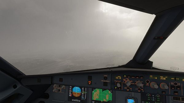 View from an aircraft cockpit showing cockpit instruments in low visibility conditions at Lisbon Airport.