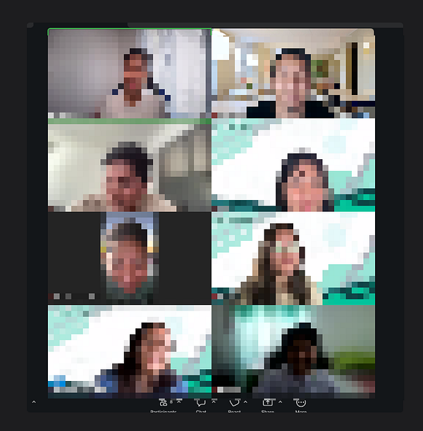 Portrait of a man wearing a suit and pink tie, smiling against a gradient pink and purple background.