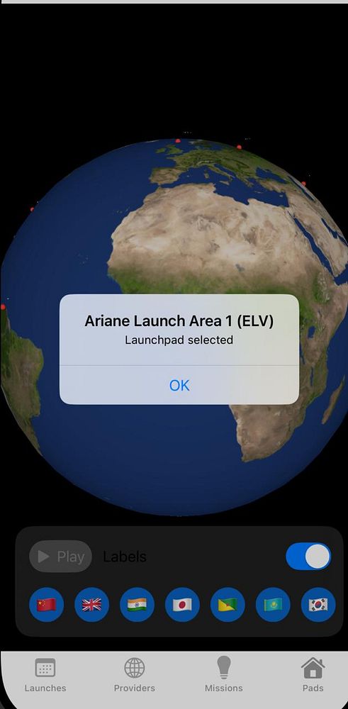 A 3D globe interface displaying the location of launch pads with a notification for a selected launch area.
