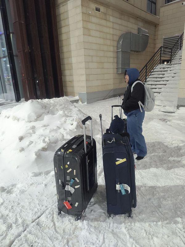 Cozy living room with festive Christmas decorations and a television setup.