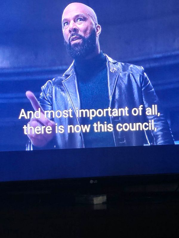 A scene from a movie or show displayed on an LG TV with a man in a leather jacket speaking, with subtitles.