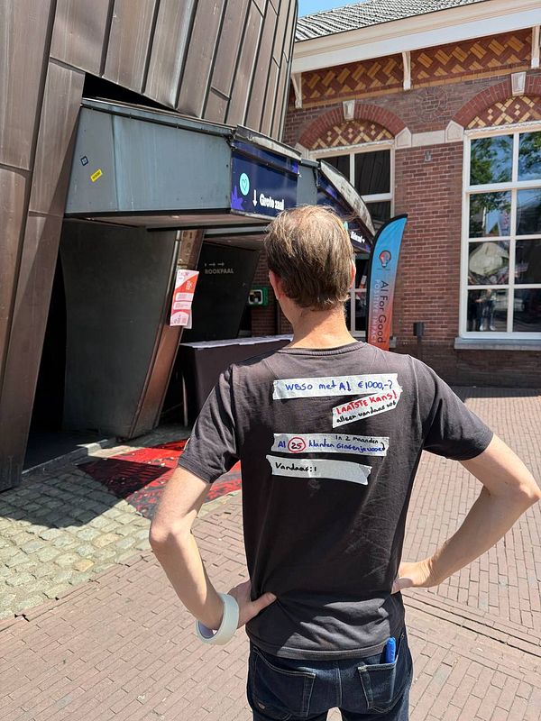 A person stands outside a building wearing a creatively designed shirt promoting guerrilla marketing for WBSO AI.