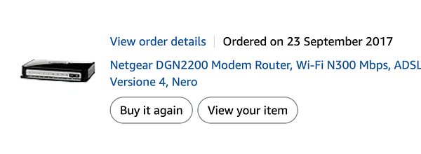 A super old Netgear modem, recommended in 2017, shown on a carpeted floor.
