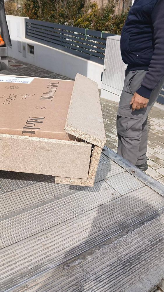 Image shows a broken wooden table with a cracked surface and multiple fractures.