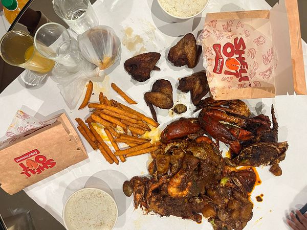 A vibrant spread of seafood and sides from Shell Out restaurant.