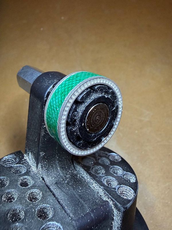 A digital artwork in progress featuring a stylized arc-shaped enamel design with vivid, glossy color gradients and abstract shapes on a black background.