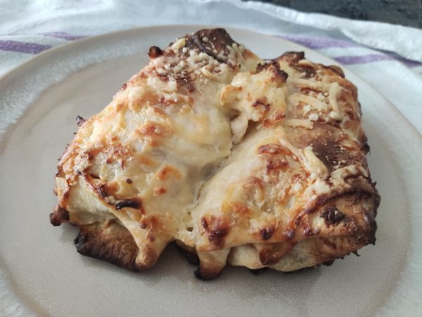 A delicious-looking Croatian taco is presented on a plate.