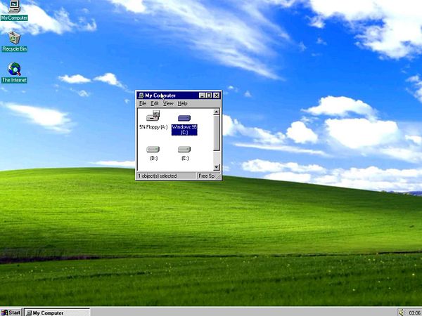 A Windows 95 desktop featuring the iconic Windows 98 wallpaper.