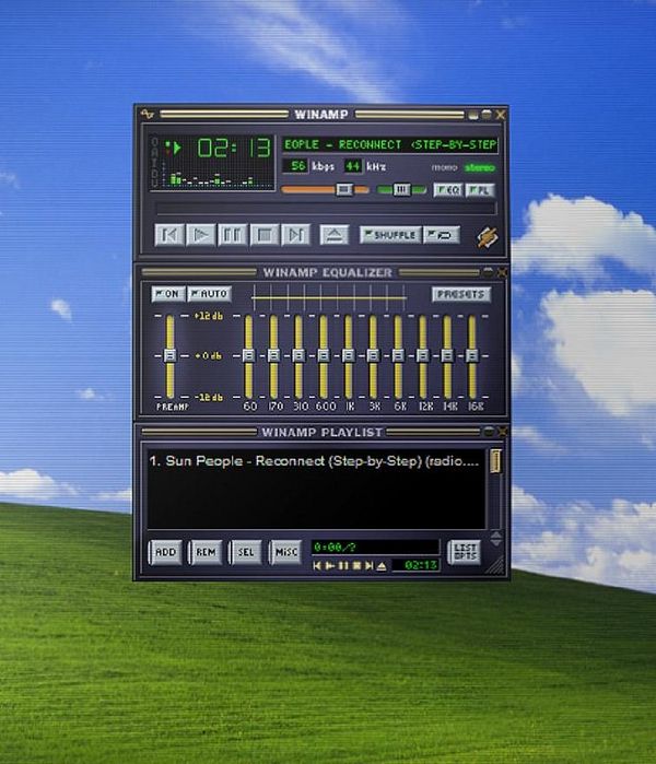Screenshot of Winamp media player with its interface and a playlist window visible.