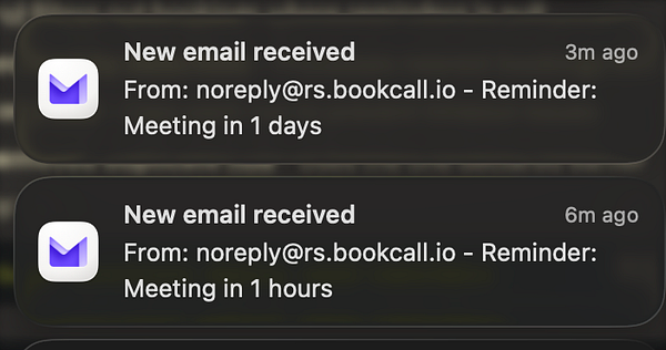 A young man with glasses and short hair sitting and reading a book in a brightly lit room with plants and bookshelves.